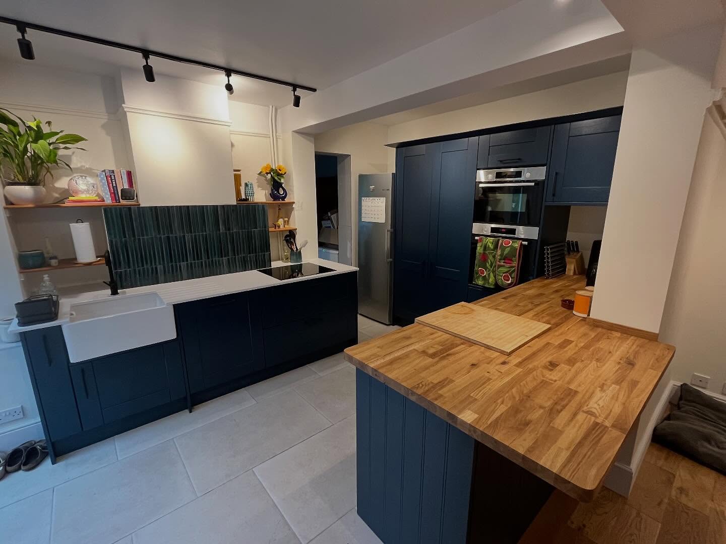 Open-plan kitchen diner with island and garden access