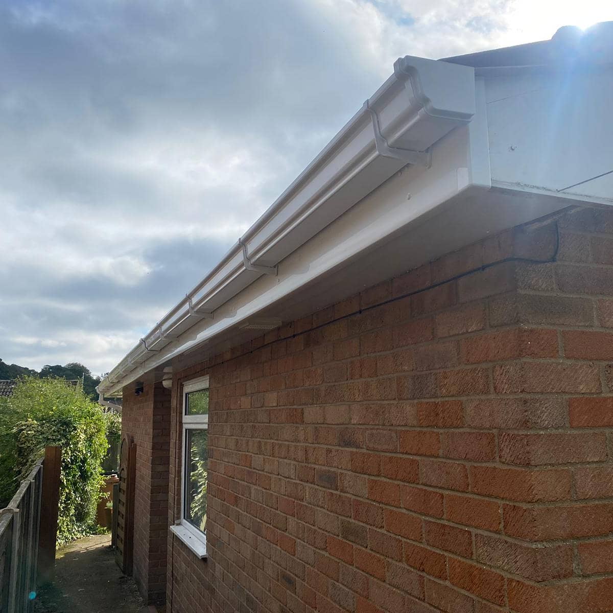 White fascia and soffit boards with guttering